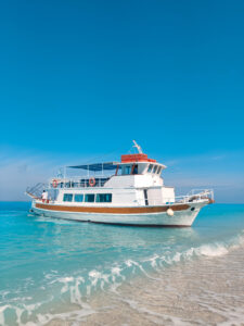 cruise boat at egremni beach greece vacation lefkada island